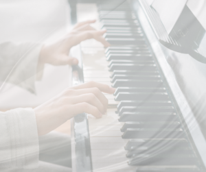 a music teacher at Harana Music Academy playing the piano