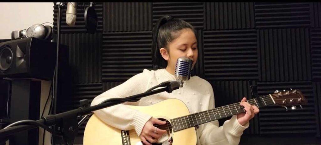 music student learning guitar and voice lessons via In-Studio sessions at Harana Music Academy